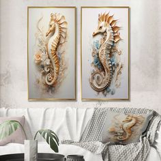 two seahorses are hanging on the wall next to each other in a living room