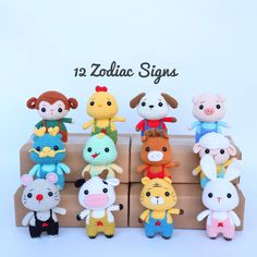 a group of stuffed animals sitting on top of a cardboard box next to each other