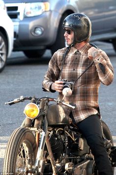 a man riding on the back of a motorcycle