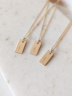 "Dainty cross necklace, 14k Gold Fill, Sterling Silver, Minimalist necklace, Cross gift, Rectangle tag, Religious, Gift for her, Faith necklace, Christian gift, Baptism gift for her, Mothers Day Gift This beautiful cross tag necklace is the perfect piece to wear everyday. PLEASE NOTE: I do not offer back stamping on any item in my shop! D E T A I L S * Gold Filled: Gold Filled Disc, Clasp and Chain. * Sterling: .925 Sterling Silver Disc, Clasp and Chain. P E N D A N T * Size: approx. 5/8\" x 5/1 Dainty Christian Jewelry, Gold Christian Jewelry, Jesus Jewelry, Christian Charm Bracelet, Christian Jewelry For Women, Christian Jewellery, Christian Gift Ideas, Dainty Cross Necklace, Necklace Christian