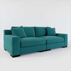 a blue couch with two pillows on it