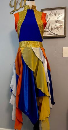 a dress on display in front of a sign