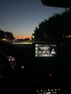 the dashboard of a car at night time