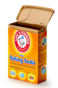 an open box of baking soda on a white background