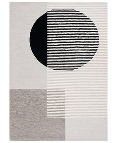 an abstract rug with black and white stripes