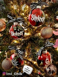 a christmas tree with ornaments hanging from it's sides and the words shrkroot on them