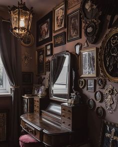 there is a piano in the corner of this room with many pictures on the wall