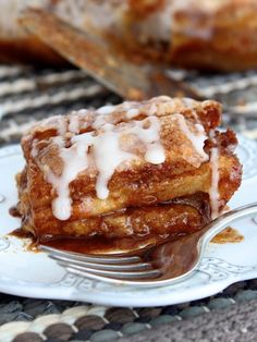 a piece of cinnamon french toast on a plate with a fork