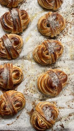 freshly baked pastries with powdered sugar on top