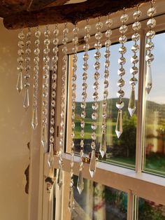 a window with beads hanging from it's side