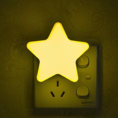 a star shaped light sitting on top of a remote control