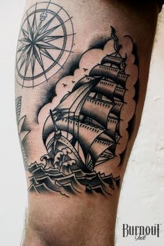 a man's leg with a black and white tattoo on it, depicting an old ship