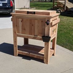 a wooden cabinet sitting on top of a sidewalk