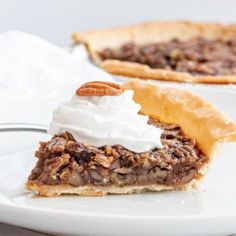 a slice of pecan pie on a white plate