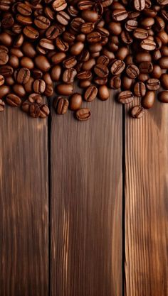 coffee beans are scattered over the wooden surface