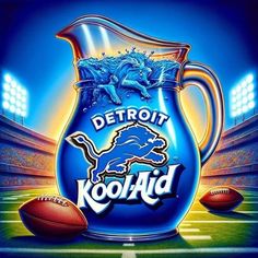 the detroit lions'logo on a blue pitcher with footballs in the field behind it