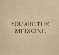 the words you are the medicine written in brown ink on a piece of parchment paper