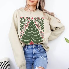 This Nordic style Christmas design is printed directly on a classic Gildan unisex sweatshirt with drop sleeves. When you think of a sweatshirt, this is one that should come to mind. If you prefer an oversized look, go up 1-2 sizes.  As all of our shirts are made to order, there are no refunds - make sure you are ordering the correct size. If there is any problem whatsoever with the printing or the garment itself, please contact me for assistance.  * 50% cotton, 50% polyester * Pre-shrunk * Class Nordic Style Christmas, Nordic Folk Art, Art Sweater, Scandinavian Christmas, Graphic Shirt, Nordic Style, Christmas Design, Christmas Sweatshirts, Graphic Shirts