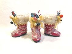 two red boots with yellow bows and snow flakes on them, sitting side by side