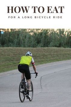 a man riding a bike down a curvy road with the words how to eat for a long bicycle ride