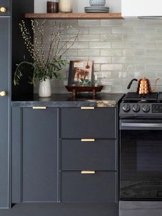 a stove top oven sitting inside of a kitchen