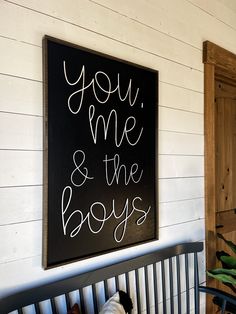 a black and white sign that says you me and the boys