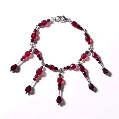 A part of the Mors Tua Vita Mea collection is a handmade beaded bracelet. Made with glass beads in a deep blood color inspired from Garnet crystals. Symbolic of love, trust, and protection in the form of blood. *partly made from repurposed materials. *length is roughly 7.5 inches / 19 cm. Blood Bracelet, Diy Outfits, Bracelet Art, Garnet Crystal, Bracelets Handmade Beaded, Arm Band, Diy Clothes, Beaded Bracelet, Garnet