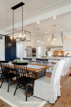 a dining room table and chairs in a kitchen