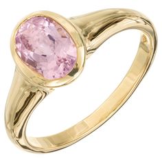 Pastel pink tourmaline bezel set Bvlgari ring. 1.68ct pink oval bezel set Tourmaline, 18k yellow gold setting. 1 oval pink tourmaline, approx. 1.68cts Size 8.25 and sizable 18k yellow gold Stamped: 750 Hallmark: Bvlgari 4.8 grams Pink Oval Sapphire Ring With Bezel Setting, Pink Oval Ring With Bezel Setting, Oval Pink Ring With Bezel Setting, Classic Pink Bezel Set Ring, Classic Pink Rings With Bezel Setting, Formal Pink Sapphire Ring With Bezel Setting, Classic Pink Oval Cabochon Ring, Bvlgari Ring, Rose Pastel