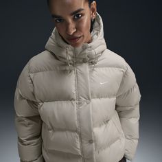 Up your outerwear game in this insulated puffer jacket. A loose fit makes it ideal for layering while the Nike Therma-FIT technology helps manage your body’s natural heat to help keep you warm in cold-weather conditions. A water-repellent finish, bungees at the hem and a hood work together to help shield you from wind and rain. Nike Thermal Jacket, Women Puffer Jacket, Nike Puffer Jacket, Nike Coat, Thermal Jacket, Jacket Fits, Puffer Jacket Women, Puffy Jacket, Fit Ideas