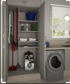 a laundry room with a washer and dryer next to a kitchen counter top