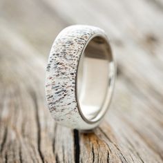 a close up of a ring on a wooden surface