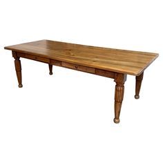 a wooden table with two drawers on one end and an extended leg at the top