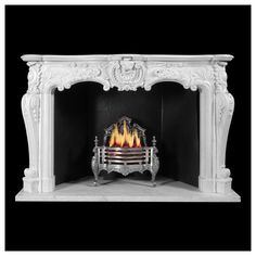 a white fireplace with an ornate mantle and fire place in the center on a black background