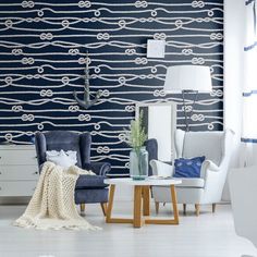 a living room with blue and white wallpaper