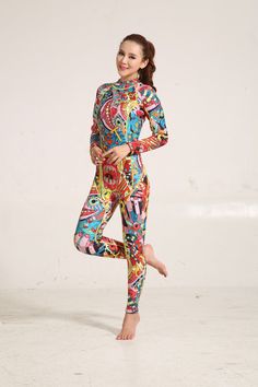 a woman in colorful patterned clothing poses for the camera