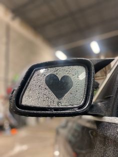 the rear view mirror has a heart on it