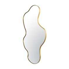 a mirror that is sitting on top of a white surface and gold trimmings