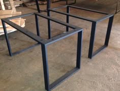 three metal frames sitting on top of a floor