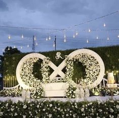 a table with flowers and candles on it in front of a sign that says love