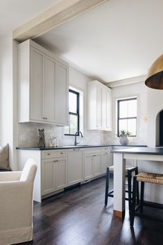 the kitchen is clean and ready to be used as a dining room or living room