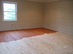 an empty room with wood flooring and white paint on the walls is pictured in this image