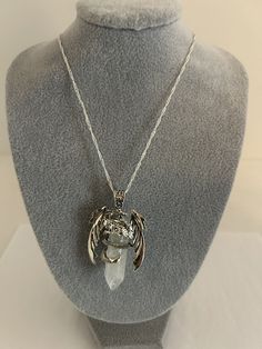 This beautiful pendant necklace features a stunning dragon design wrapped around a natural white quartz crystal. The hexagon shape and white color of the stone make it a unique and eye-catching addition to any jewelry collection. The sterling silver chain is 22 inches long with a lobster clasp. Also included is a 19 inch black rope with stainless steel lobster clasp. The necklace is perfect for those who love dragon-themed jewelry. Add this unique and powerful piece to your collection today! Shipped with extra care and handling from smoke-free home. White Quartz Crystal, Beautiful Pendant Necklace, Quartz Crystal Pendant, Dragon Necklace, Black Rope, White Dragon, Witch Aesthetic, Dragon Design, Themed Jewelry