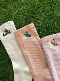 These butterfly socks are customized on crew socks. The butterfly embroidery has a black bodice with light color for detailing on the top of the sock. It is a simple butterfly that can add to any outfit. Based on the color way, these trendy socks can bring y2k energy with the bright spring colors. We've narrowed these 3 color ways for the butterfly embroidery crew socks to match any wearer, if you are interested in a different color story we can customize for you. MEDIUM SIZE (6-10 WOMEN, 6-8 ME Cute Cheap Socks For School, Trendy Cheap Socks With Letter Print, Trendy Cheap Letter Print Socks, Print Nike Socks, Cheap Adjustable Pink Digital Watch, Cheap Trendy Socks With Letter Print, Affordable White Socks With Letter Print, Cute Nike Socks, Sock Embroidery