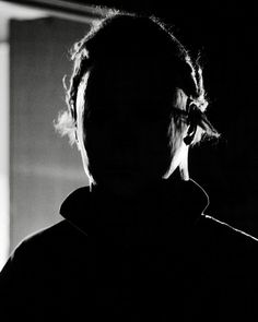 black and white photograph of a person in the dark