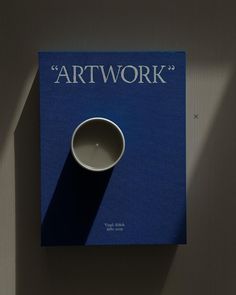 the cover of an art work book with a coffee cup on it's side