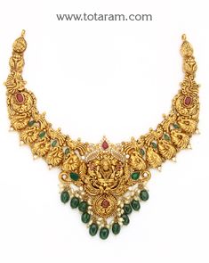 22 Karat Gold "Lakshmi - Peacock" Necklace with Cz, Color Stones, Beads & Pearls (Temple Jewellery)

Enhance Your Beauty with 22 Karat Gold "Lakshmi - Peacock" Necklace!    Indulge in the exquisite craftsmanship of Indian gold jewelry with this stunning 22 Karat Gold "Lakshmi - Peacock" Necklace from Totaram Jewelers. Adorned with sparkling CZ stones, colorful beads, and lustrous pearls, this temple jewelry piece is a true masterpiece that will elevate your style to new heights Luxury Temple Jewelry Pearl Necklace For Diwali, Luxury Traditional Temple Necklace With Stone Work, Luxury Bollywood Kundan Temple Necklace, Luxury Chandbali Necklace For Anniversary, Luxury Gold Kundan Necklace With Diamonds, Luxury Gold Temple Necklace For Festive Occasion, Luxury Yellow Gold Kundan Necklace In Temple Style, Luxury 22k Gold Jewelry With Zari Work, Luxury Jeweled Temple Jewelry Necklaces