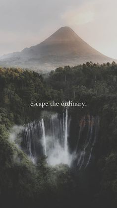 a waterfall with the words escape the ordinary above it in front of a large mountain