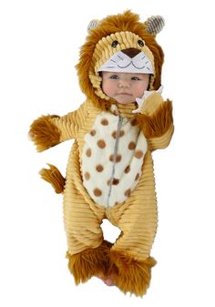 a baby in a lion costume is standing on one leg and has his hand up to his mouth