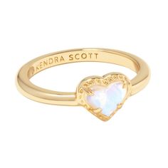 This sweet heart style has us wrapped around its finger. The Anna Dichroic Glass 14k Gold Band Ring features an adorable heart stone centered on a timeless gold band. Romantic and chic, this is the perfect ring to gift to a loved one (or just yourself—you deserve it). Designer, founder, and philanthropist Kendra Scott started her company in 2002, just three months after her first son was born. Her commitment to innovation, quality, customer service, and detail has taken her from a small startup to a billion-dollar brand. Kendra Scott is known for its design and material innovation, use of color, and signature shapes. As the lifestyle brand continues to grow, Kendra and her namesake company remain true to its founding philosophy of Family, Fashion, and Philanthropy for both customers and em Kendra Scott Ring, Cute Promise Rings, Preppy Jewelry, Heart Stone, Jewelry Accessories Ideas, Brass Band, Girly Accessories, Jewelry Essentials, Jewelry Lookbook